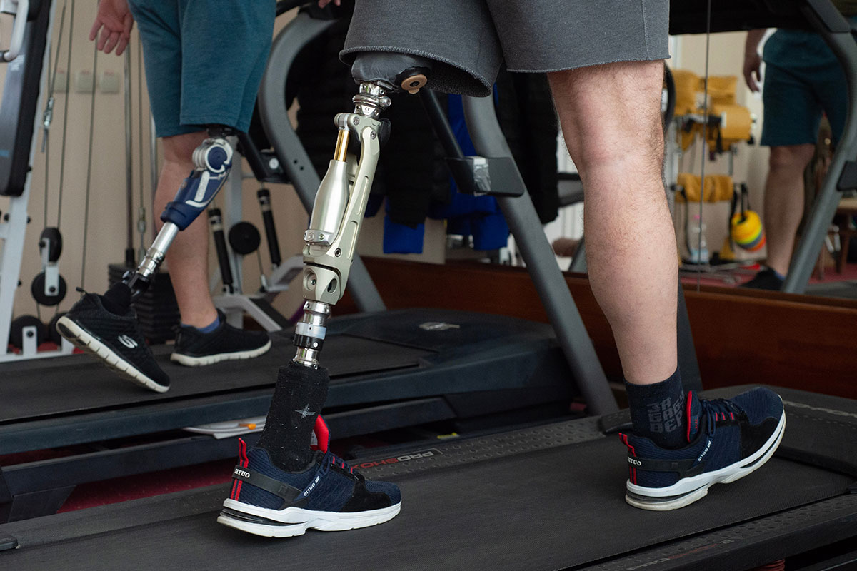 Lviv Ukraine February 01 2023 Ukrainian servicemen on prosthetics walking on treadmills in a rehabilitation center near Lviv