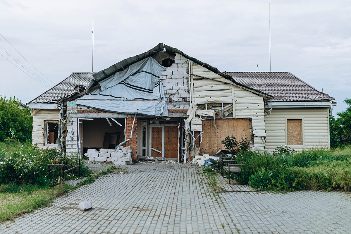 Bilozirka, Ukraine - March 26, 2023: War of Russia against Ukraine. Damaged and destroyed hospital, medical center in village after bomb explosions.